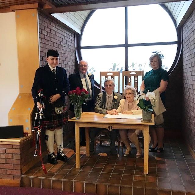 A couple and guests at Gretna Registration Office