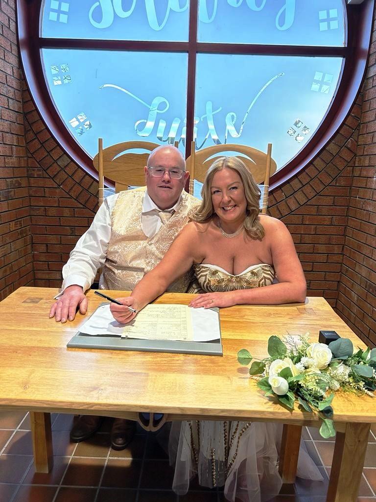 A couple signing the register at Gretna Registration Office