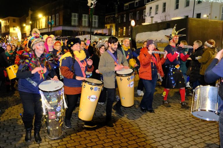 People gather on Dumfries High Street in creative costumes for the Big Burns Supper parade in 2026.