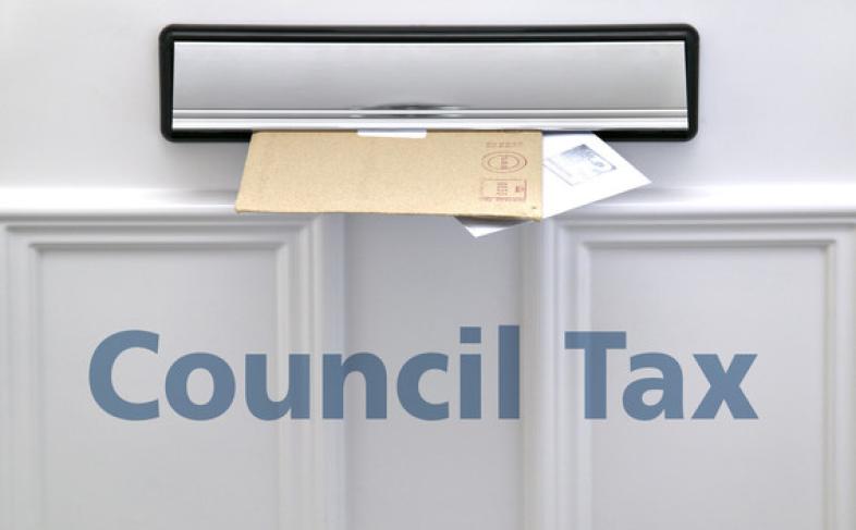 Letters in a letter box, text reads council tax