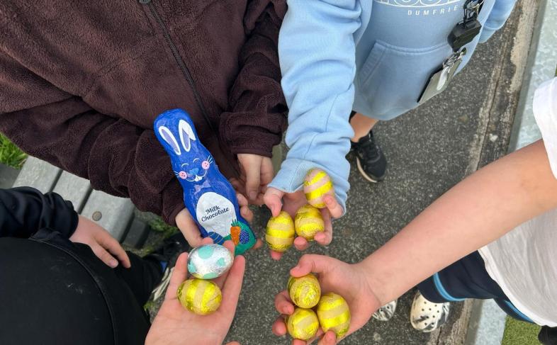 Young people holding Easter chocolates