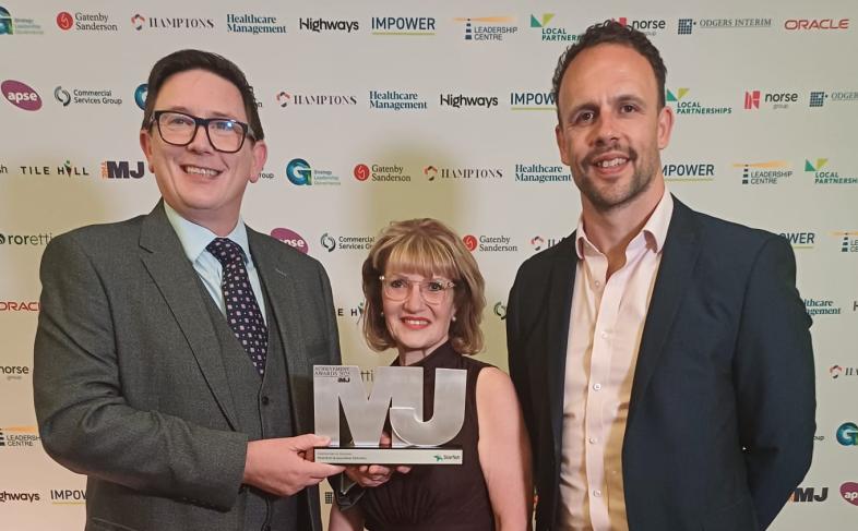 Members of the team with the MJ Award