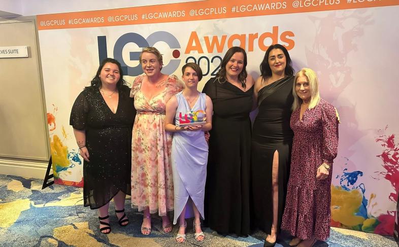 Volunteers, staff and councillor with the award