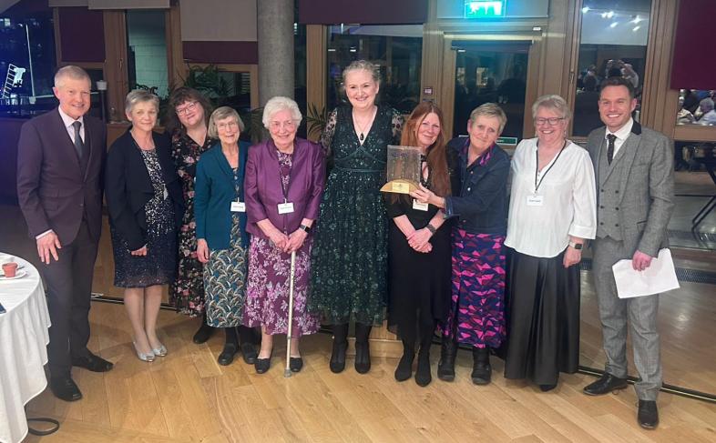 Group of leaners receiving award