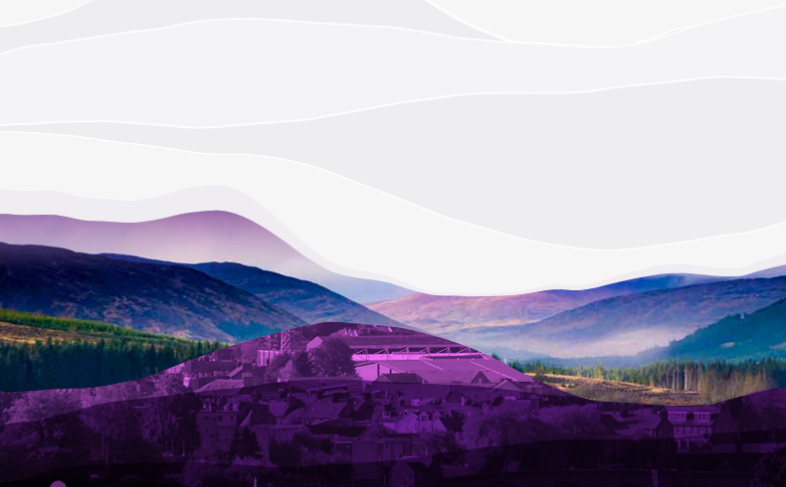 Scenic landscape of purple mountain town skyline at dusk with hills, misty valley and layered lighting effects