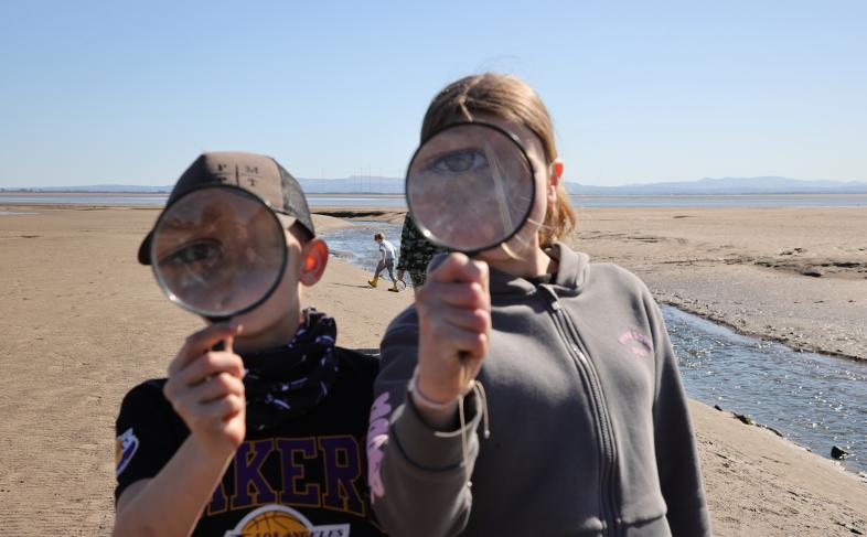 Young wildlife explorers with magnifying glass