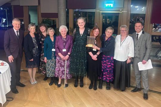 Group of leaners receiving award