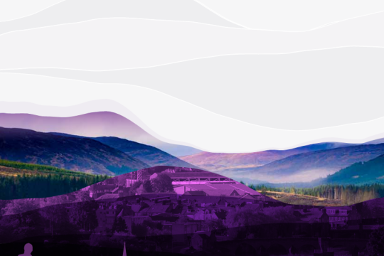 Scenic landscape of purple mountain town skyline at dusk with hills, misty valley and layered lighting effects