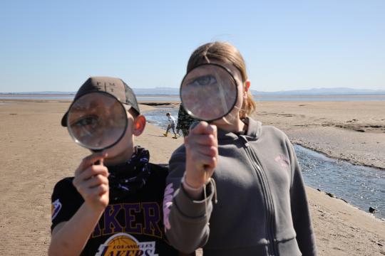 Young wildlife explorers with magnifying glass