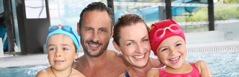 Family in swimming pool